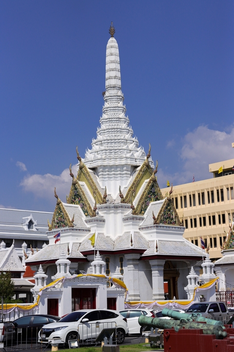       White temple with gold and colorful details
  