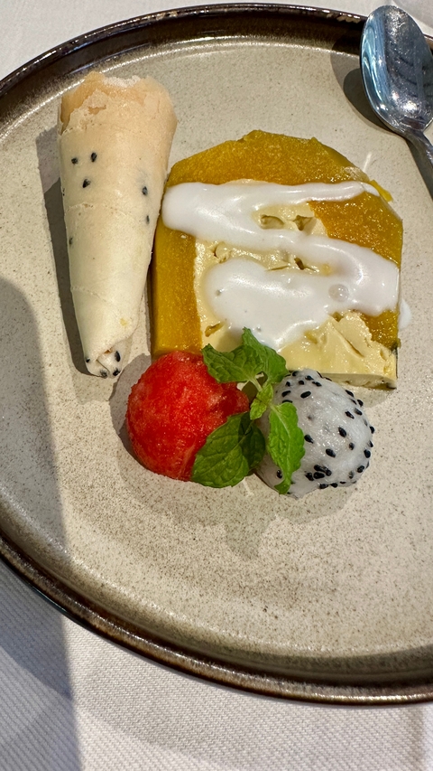 Plate with various desserts including dragonfruit and watermelon.