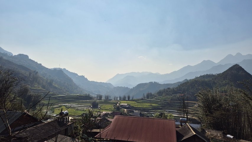 Panoramic view of rice terraces and mountains.