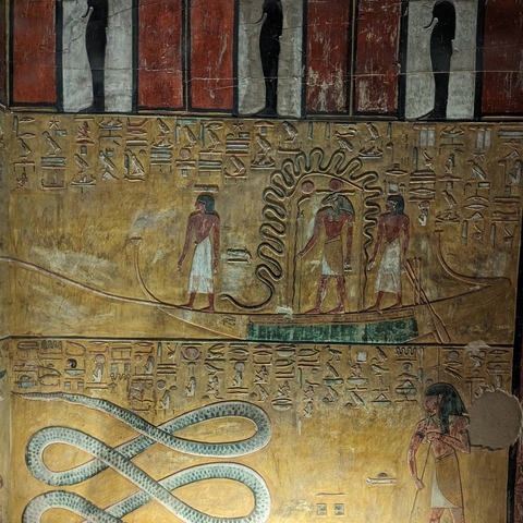 Ancient Egyptian wall carvings and hieroglyphs.