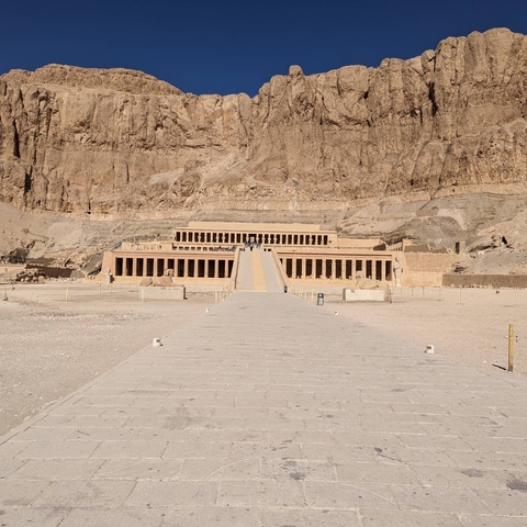       Grand temple structure in a desert location.
  