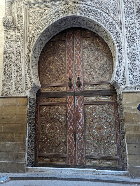       Decorative door with intricate carvings.
  