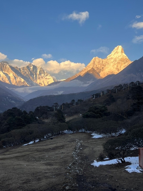       Scenic view of mountains with colorful light at dusk.
  