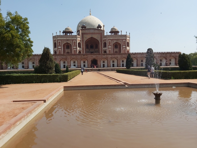 Historic building with fountain and garden