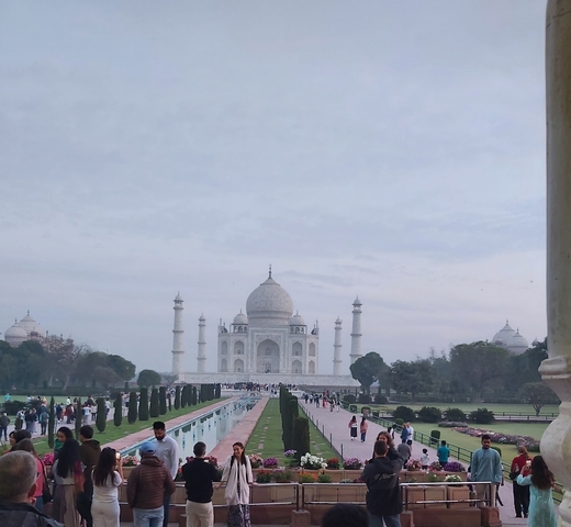The Taj Mahal with a large group of tourists in the foreground
