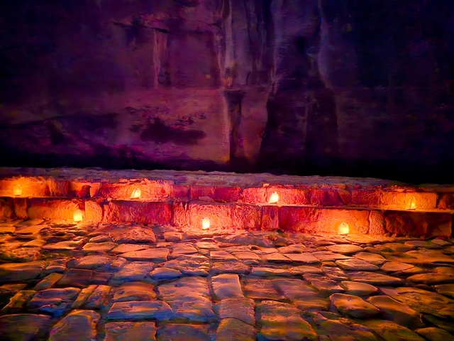 Candles illuminating stone steps at night