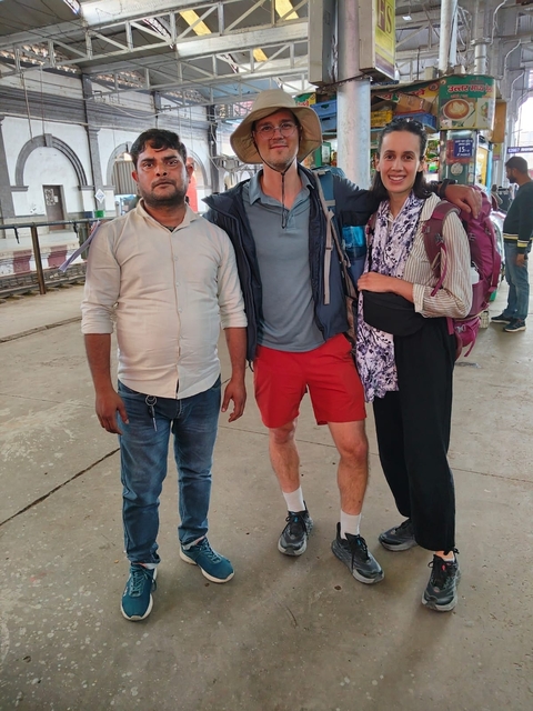       Group photo at a train station.
  