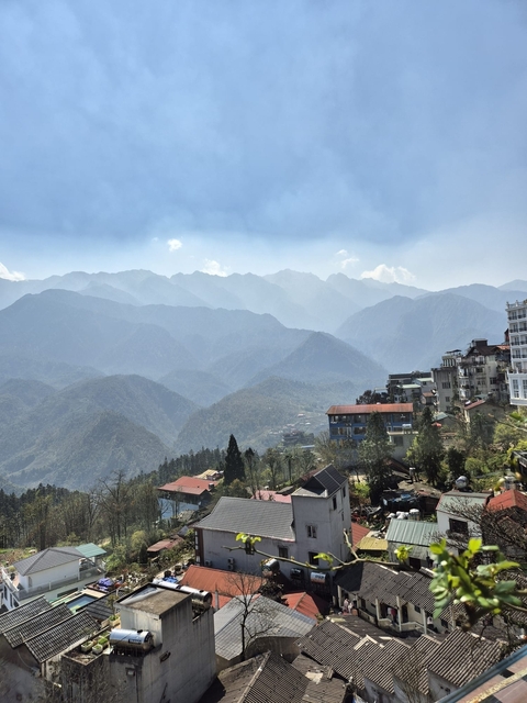       Mountain range with a town in the valley.
  