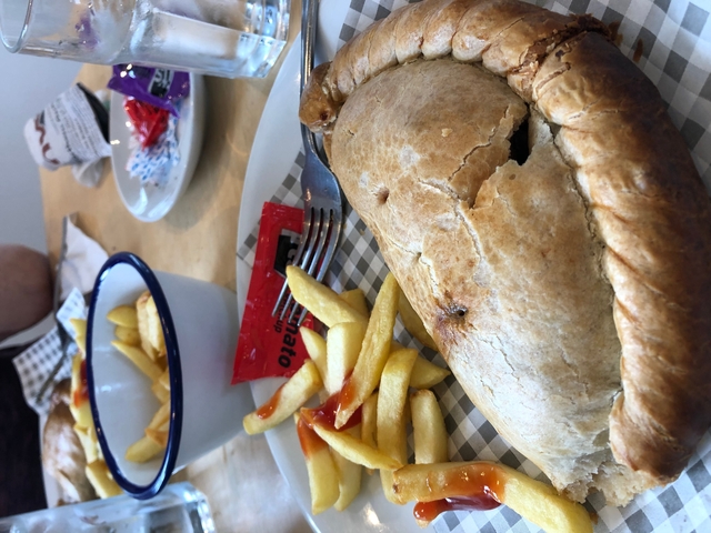       Traditional meal with pie and fries.
  