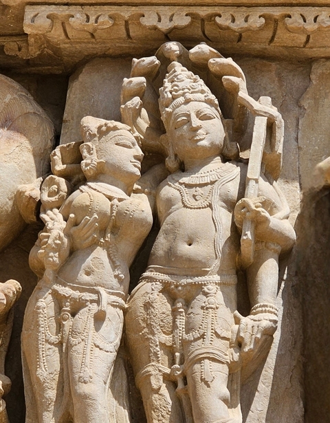       Intricate stone carvings of human figures in Khajuraho.
  