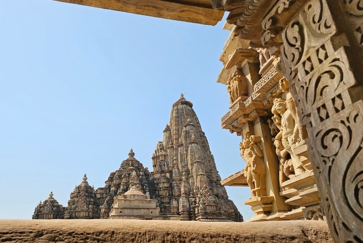       Intricate stone sculptures on a temple in Khajuraho.
  