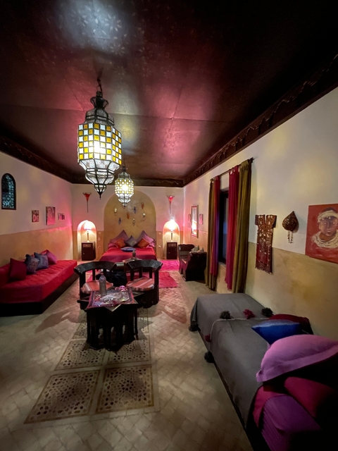 Interior of a richly decorated room with Moroccan-style furnishings.