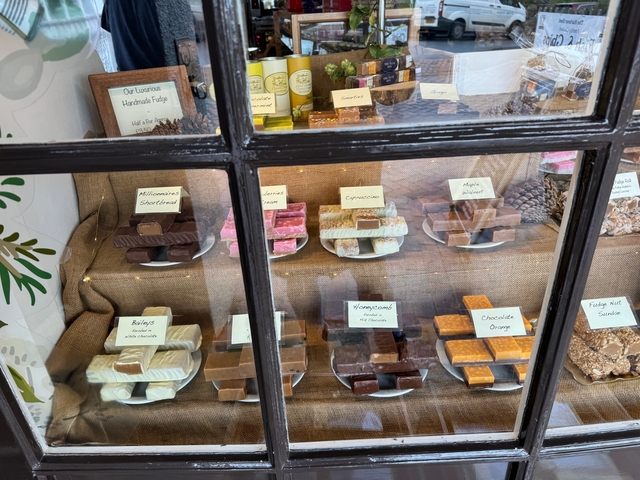 A window display of various handmade fudge
