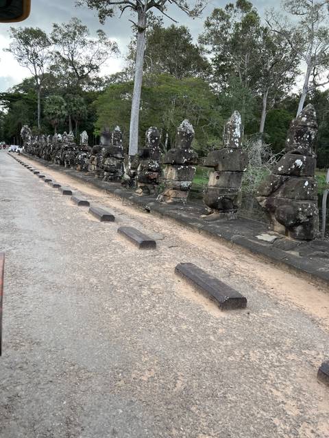       Sculptures lined up on a roadside
  