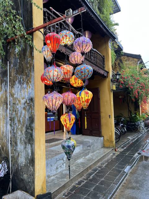       Colorful lanterns hanging outside a building
  
