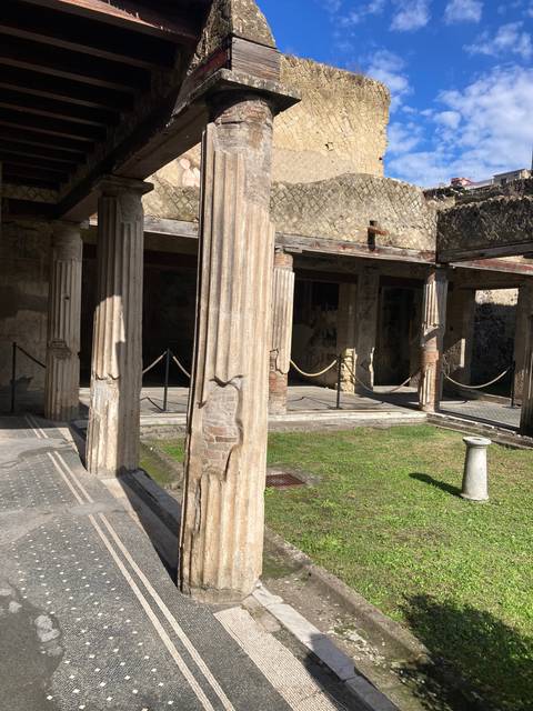       Ruins with ancient stone columns against a blue sky.
  
