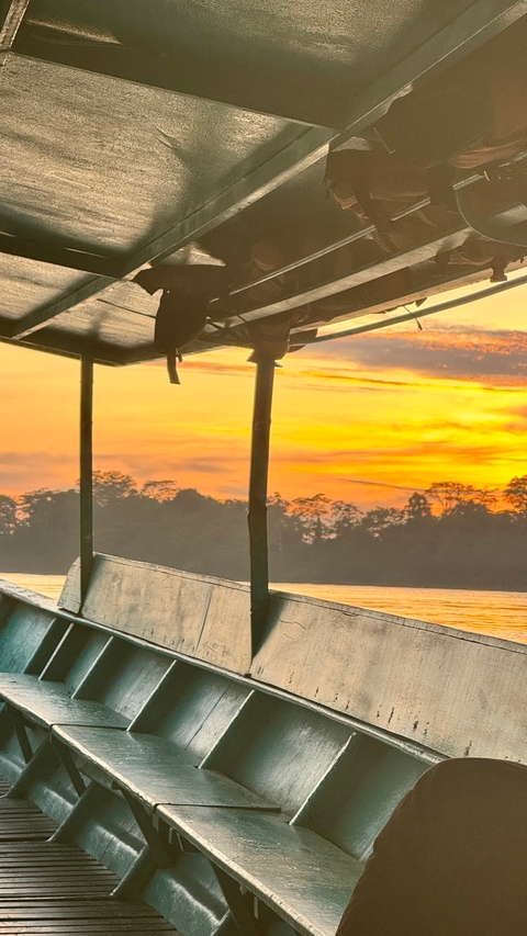 Beautiful sunset view over a river from a boat.