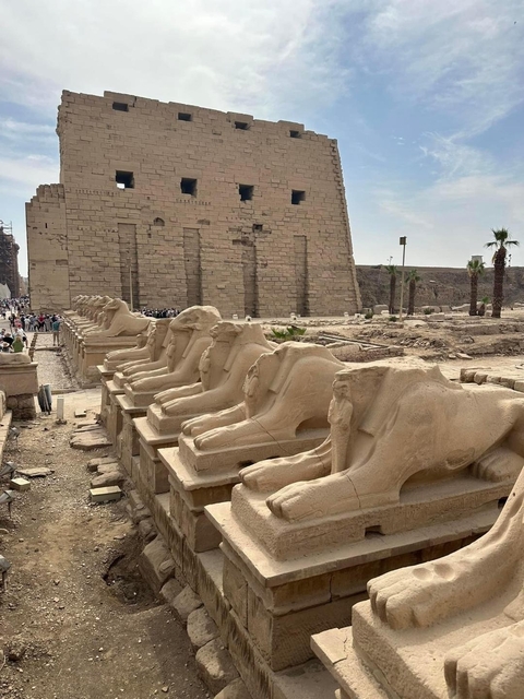 Ancient stone pathway with sphinx statues in Luxor.