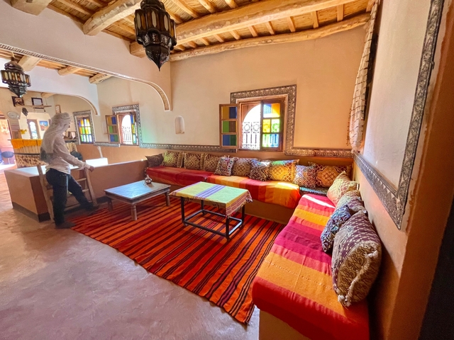       Cozy interior of a Moroccan living room with traditional decor.
  