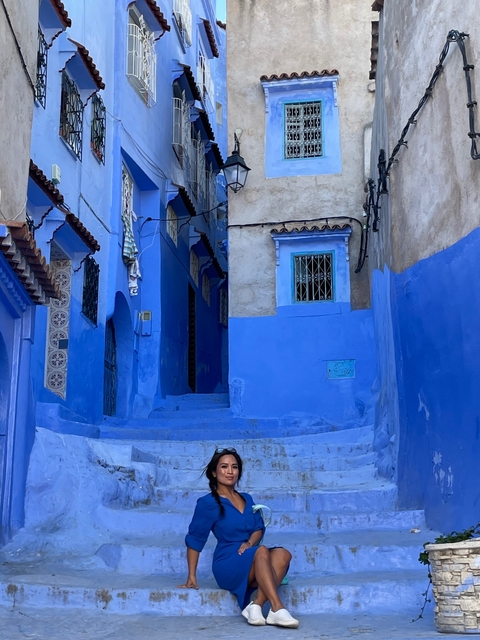       Blue-painted alleyway in a traditional Moroccan medina.
  