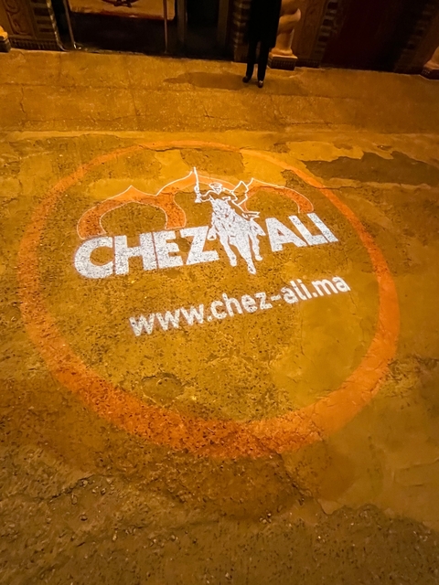 Logo for Chez Ali featuring a horse and rider on a dirt background.