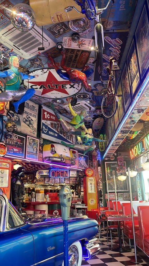      Interior of a colorful and eclectic bar or cafe.
  