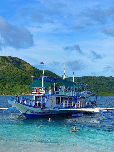 Colorful boat on the sea with Philippine flag.
