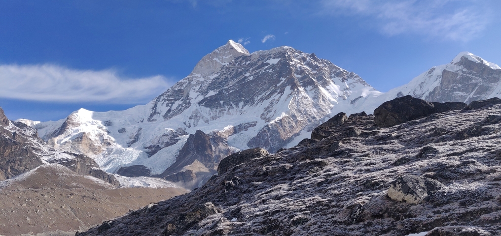       Snow-covered mountains under a clear blue sky.
  