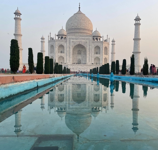       Reflection of the Taj Mahal in a water feature.
  