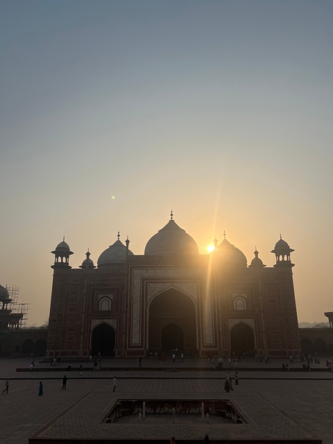       Silhouette of a historic building during sunset.
  
