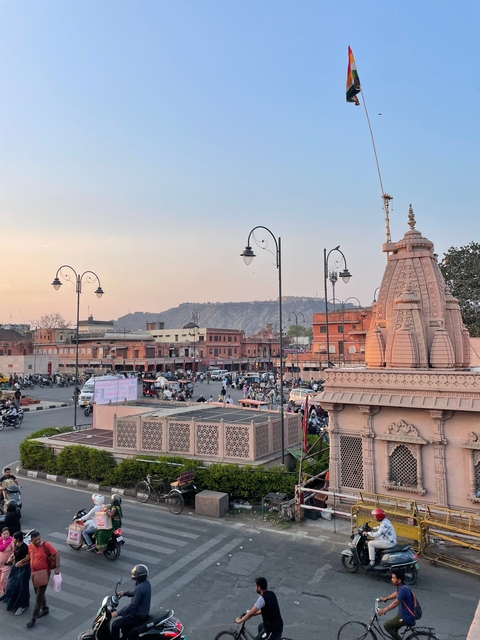       Cityscape with historic architecture and hills.
  