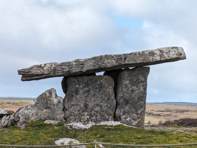 Ancient stone dolmen in a natural setting.