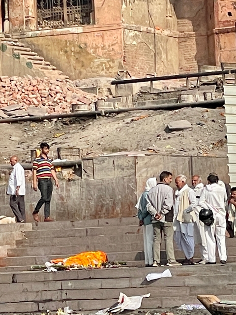 Group of people standing by a construction site.