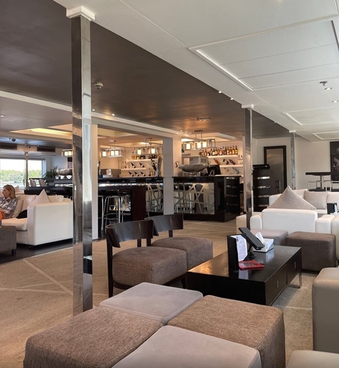 Interior of a modern cafe or bar with chairs and tables.