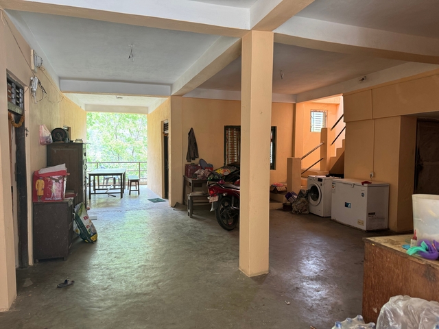 Indoor view of a building with open hallway and furniture.