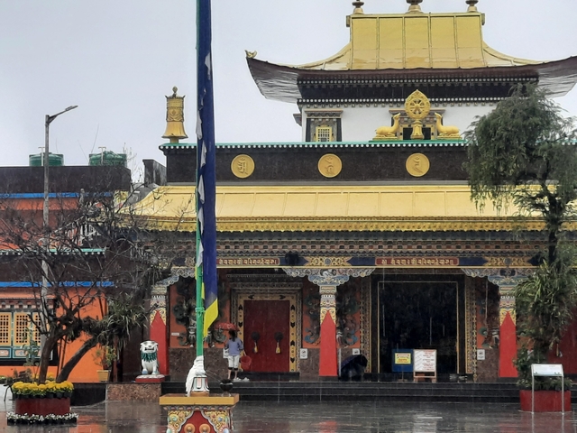       Colorful temple facade with traditional architectural elements.
  