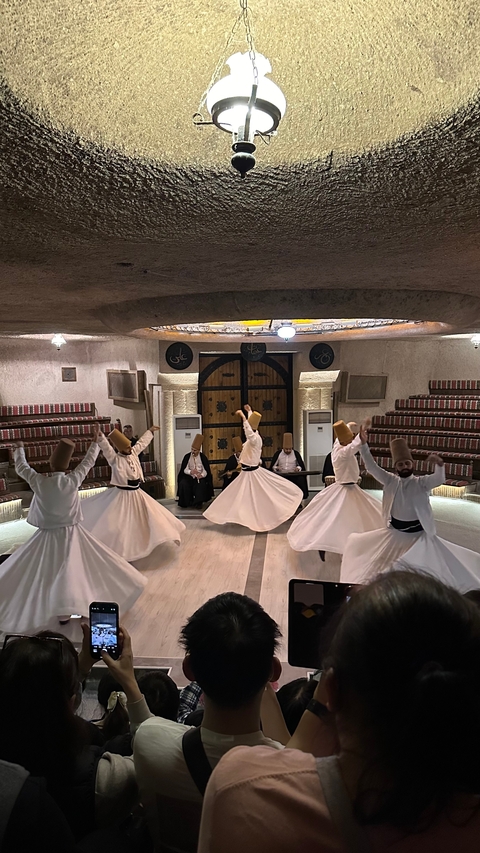 Dancers performing traditional Sufi whirling.