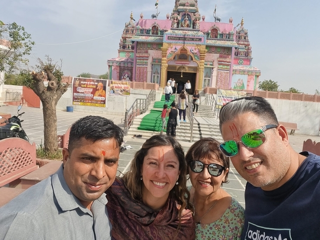       Selfie in front of a colorful temple.
  