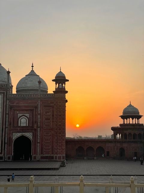      Sunset with silhouettes of architectural domes.
  