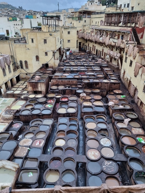 Traditional leather tanneries with colored vats.