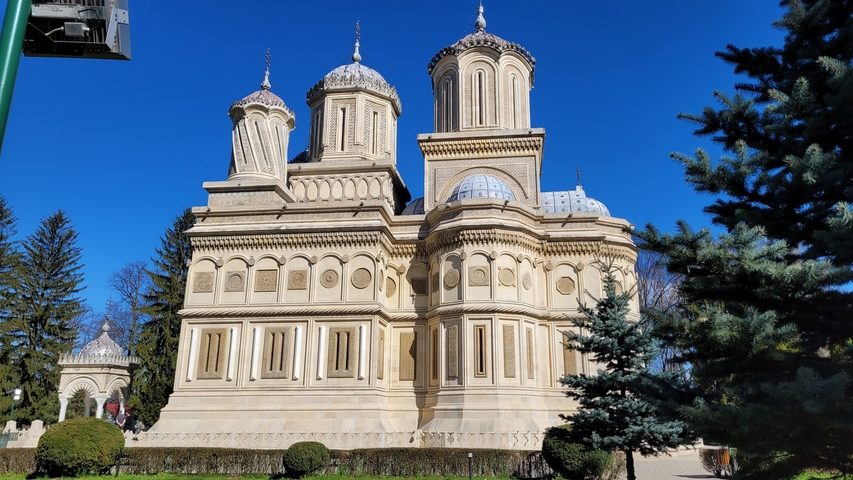 Historic church with detailed architecture and clear blue sky.