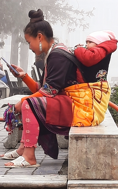       Person in colorful traditional clothing.
  