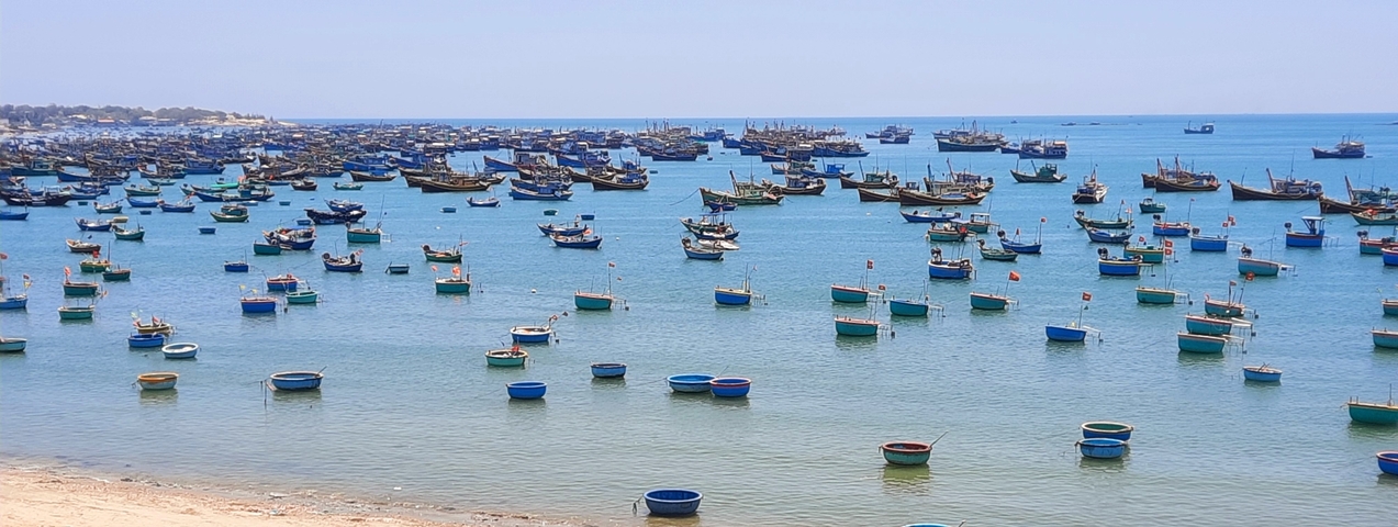 Fishing boats floating on the sea.