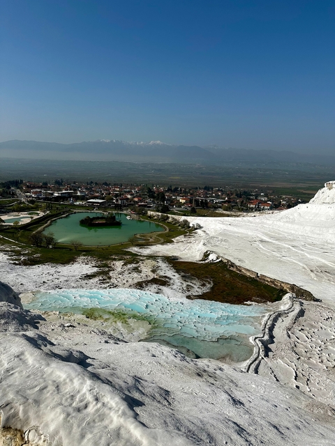 Aerial view of Pamukkale white terraces and surrounding landscape.