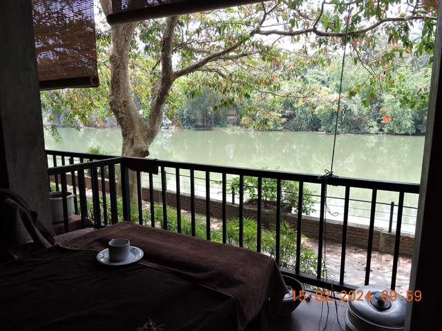 Cup of tea on a table with a river view