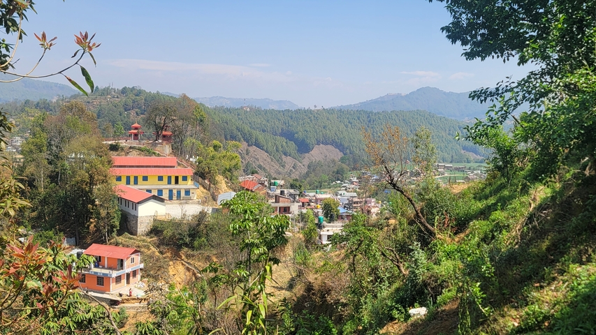 Colorful buildings in a hilly area.