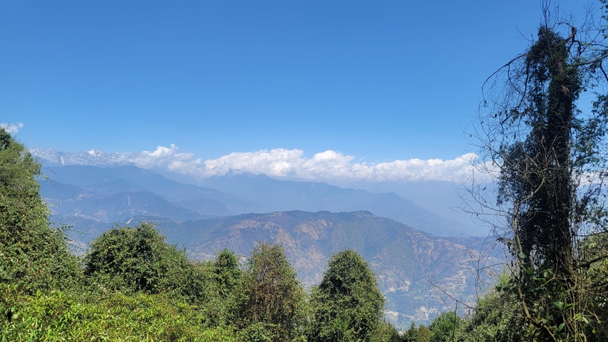 Mountain range under a clear blue sky.