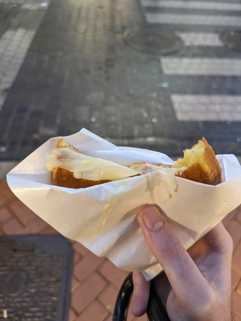 Cheese-filled snack in paper wrapper.