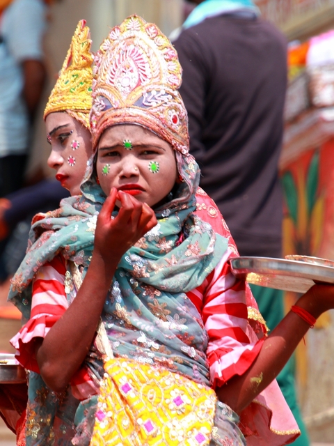       Person with face paint during a festival
  