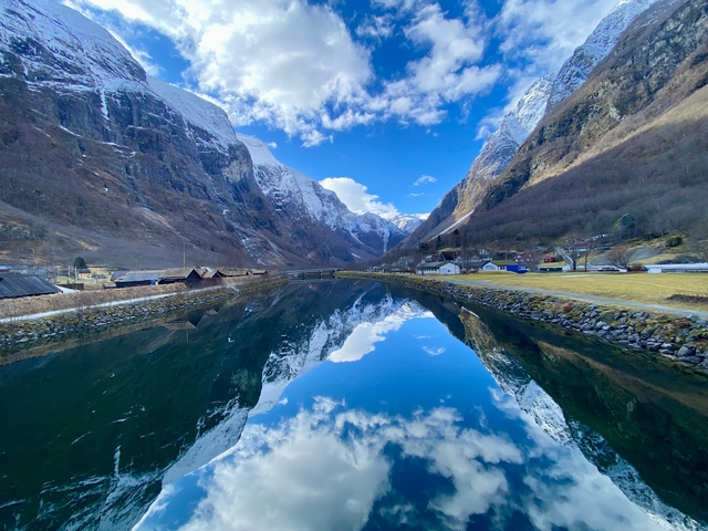 Beautiful fjord with reflections of snowy mountains